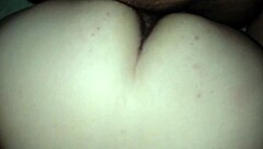 wife sits comfortably on the couch enjoying a relaxing moment