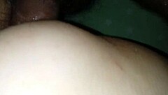 wife sits comfortably on the couch enjoying a relaxing moment