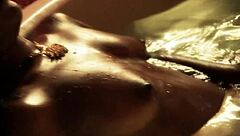 She dances with a teasing striptease in the softcore scene.