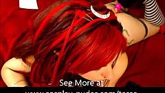 Hey, check out this hot redhead in cosplay using vibrator on her pussy