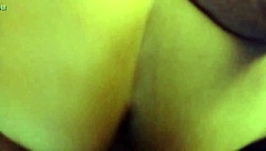 In the dimly lit room, a thick white ass bends over for intense anal fucking in doggystyle position