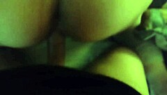 In the dimly lit room, a thick white ass bends over for intense anal fucking in doggystyle position
