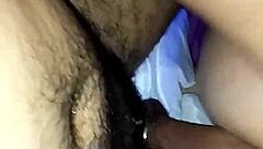 She's bent over in doggy style, riding hard.