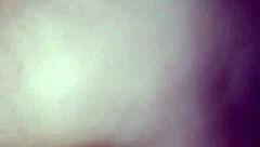 She's bent over in doggy style, riding hard.