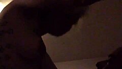 In this retro blue film, a tattooed performer engages in intense riding