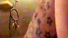 In this retro blue film, a tattooed performer engages in intense riding