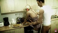 a blonde woman plays with cream and her man's food in the kitchen