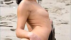 Modelz beauty poses seductively in the sand with stunning looks.