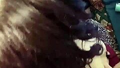 brunette babe clamps her nipples in close up view