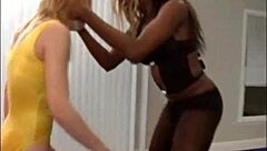 Ebony lesbian girls engage in lifting and carrying each other passionately