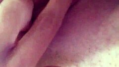 A tattooed woman enjoys solo time in the bathroom, exploring her body with gentle touches.