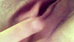 A tattooed woman enjoys solo time in the bathroom, exploring her body with gentle touches.