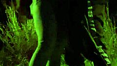 Teens engage in mutual masturbation and blowjob in outdoor field with watchers.