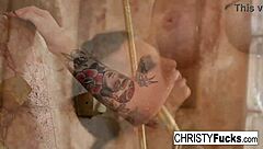 Christy Mack with big tits and tattoo masturbates her pussy in the shower