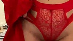 Watch this brunette tease in red lingerie?