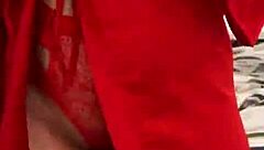 Watch this brunette tease in red lingerie?