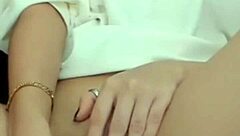 The hot brunette feels excited showing her wet pussy on webcam during masturbation.