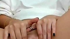 The hot brunette feels excited showing her wet pussy on webcam during masturbation.