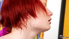 Redhead teen enjoys big cock in pussy without removing shirt.