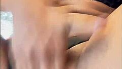 A woman in lingerie masturbates solo and cums.