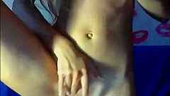 A cute blonde teen webcam girl uses a huge dildo for solo masturbation