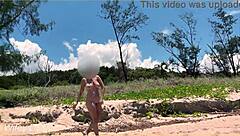 Watch my wife play football nude on the public clothed beach? She's flashing her big tits!