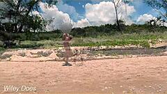 Watch my wife play football nude on the public clothed beach? She's flashing her big tits!