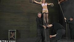 The beautiful woman is tied up, facing wild punishment.