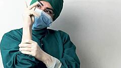 Nurse plays with latex gloves in hospital