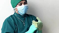 Nurse plays with latex gloves in hospital