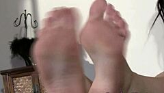 babe teases with scrunched foot soles in softcore display.