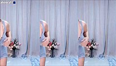 Asian girl with big tits and cute Korean style dances wildly to reveal sexy boobs in short skirt