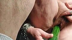 Granny fucks hairy slit with cucumber in raw action