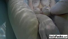 Sexy Nadia bathes with rubber duckies in solo relaxation