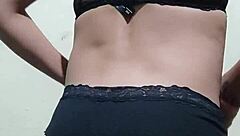 Gay guy tries on his underwear in a casual setting