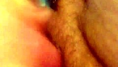 She rubs her hairy pussy again, building to cum.