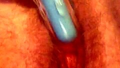 She rubs her hairy pussy again, building to cum.