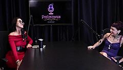 Annie Clementine records a group event with family support in sheer red.