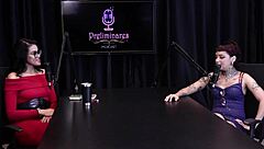 Annie Clementine records a group event with family support in sheer red.