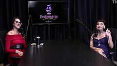 Annie Clementine records a group event with family support in sheer red.