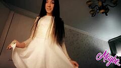 Sweet brunette babe in white dress fingers herself hard.