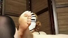 a woman in pantyhose and stockings relaxes at home