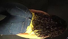 Moving her butt and hips to the music in a sexy outfit with long nails