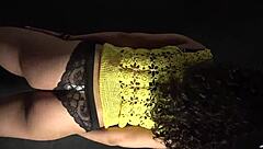 Moving her butt and hips to the music in a sexy outfit with long nails