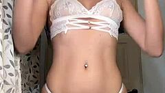 a latina girl rips her clothes off in a steamy striptease solo