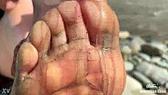 Goddess flaunts filthy nylon feet in torn pantyhose by river