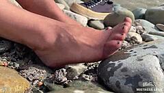 Goddess flaunts filthy nylon feet in torn pantyhose by river