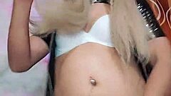 latex transsexual indulges in solo play, exploring desires through intense self-pleasure.