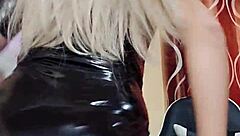 latex transsexual indulges in solo play, exploring desires through intense self-pleasure.