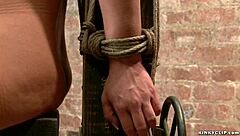 How does a gagged and bound lesbian handle deepthroat choking with bizarre tied up toys?